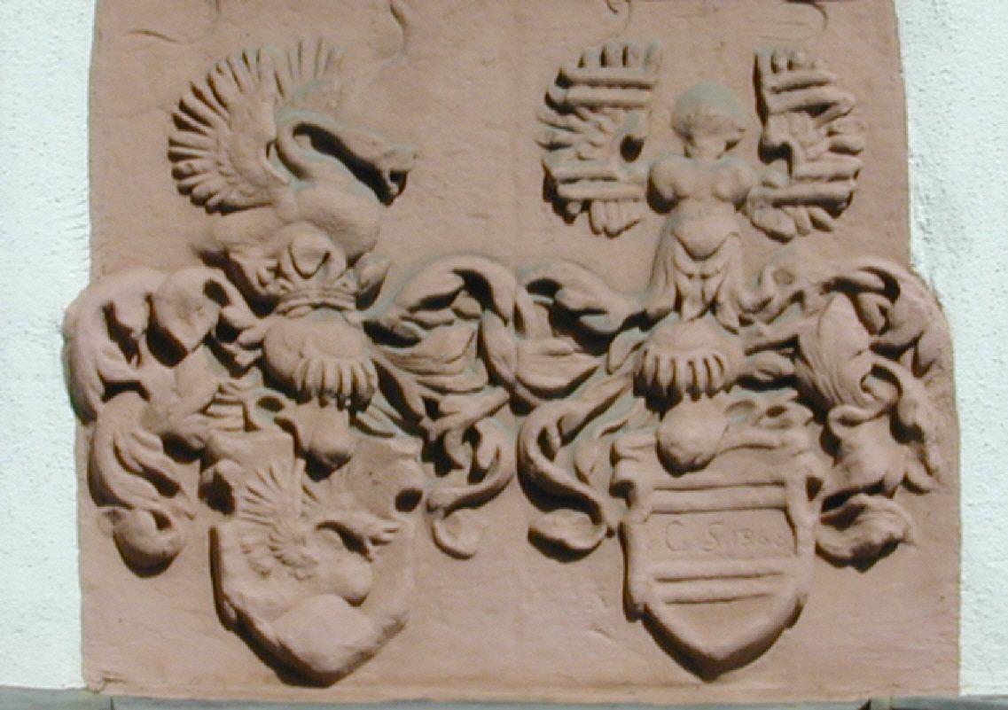Wie heißt das Gebäude mit diesem Wappen?